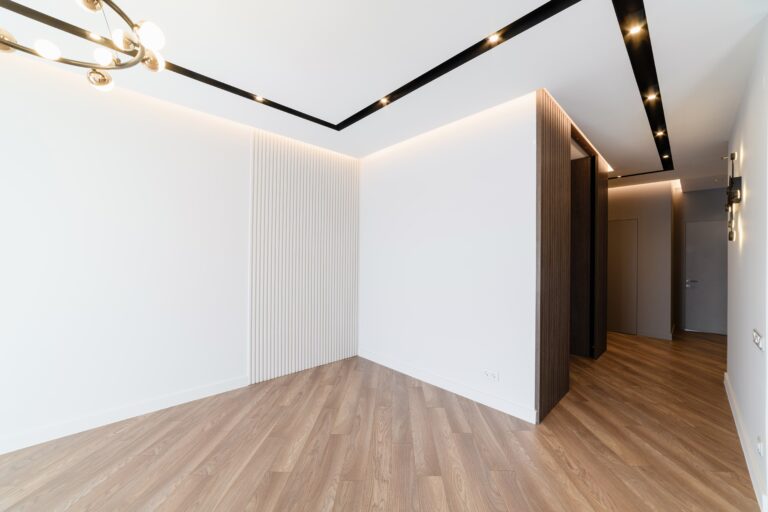 new-stylish-interior-room-with-white-walls-dark-floors-min